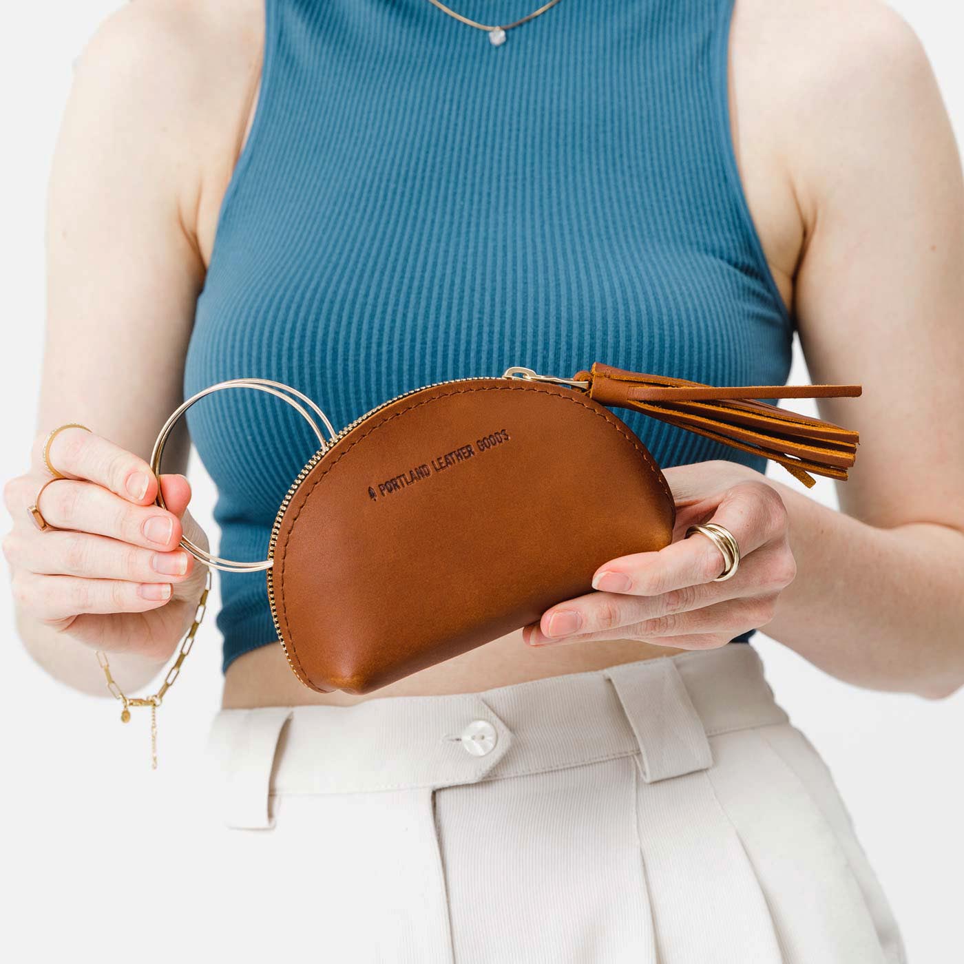 All Color: Honey | Small leather zippered pouch with tassel