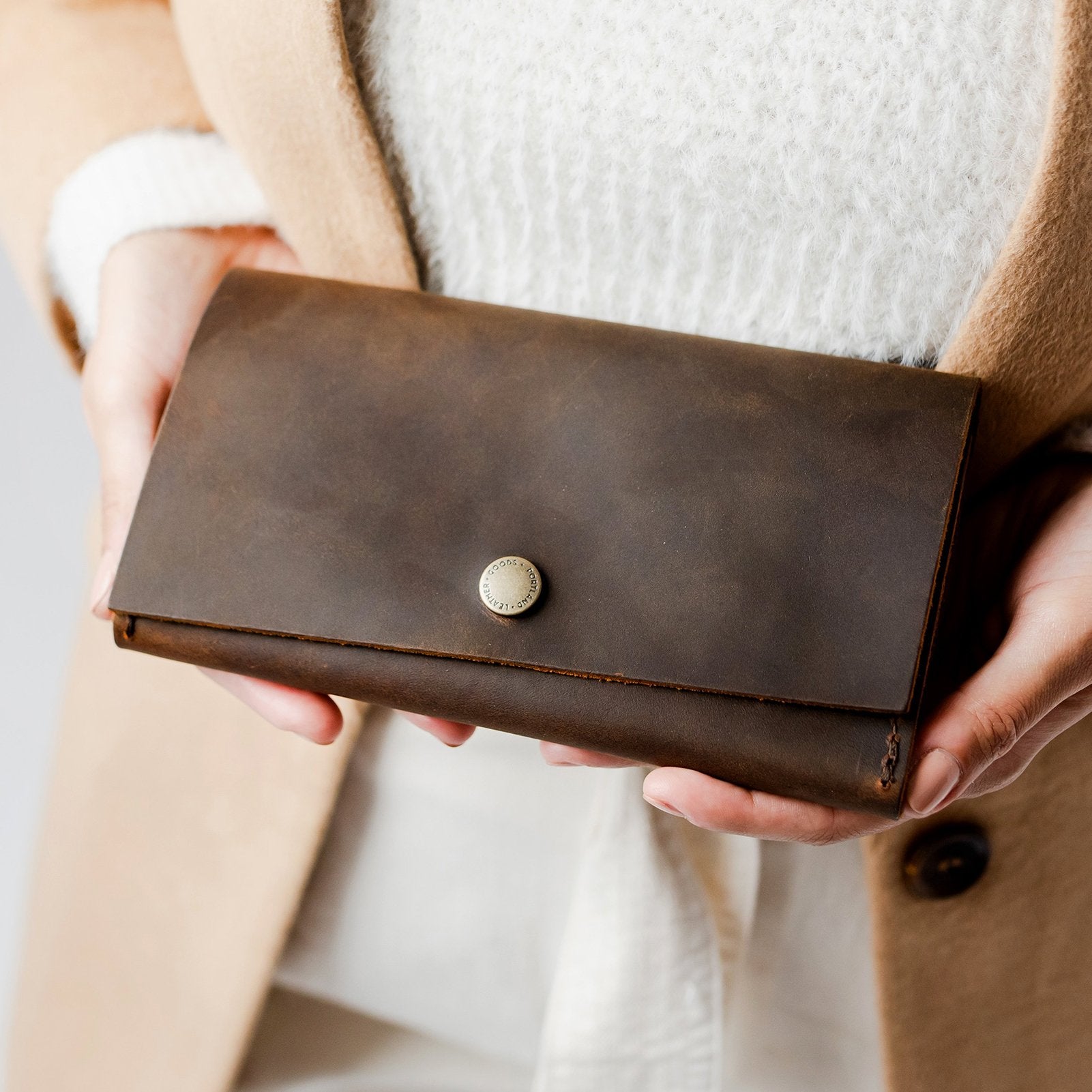 Canyon | Model holding leather wallet with snap closure