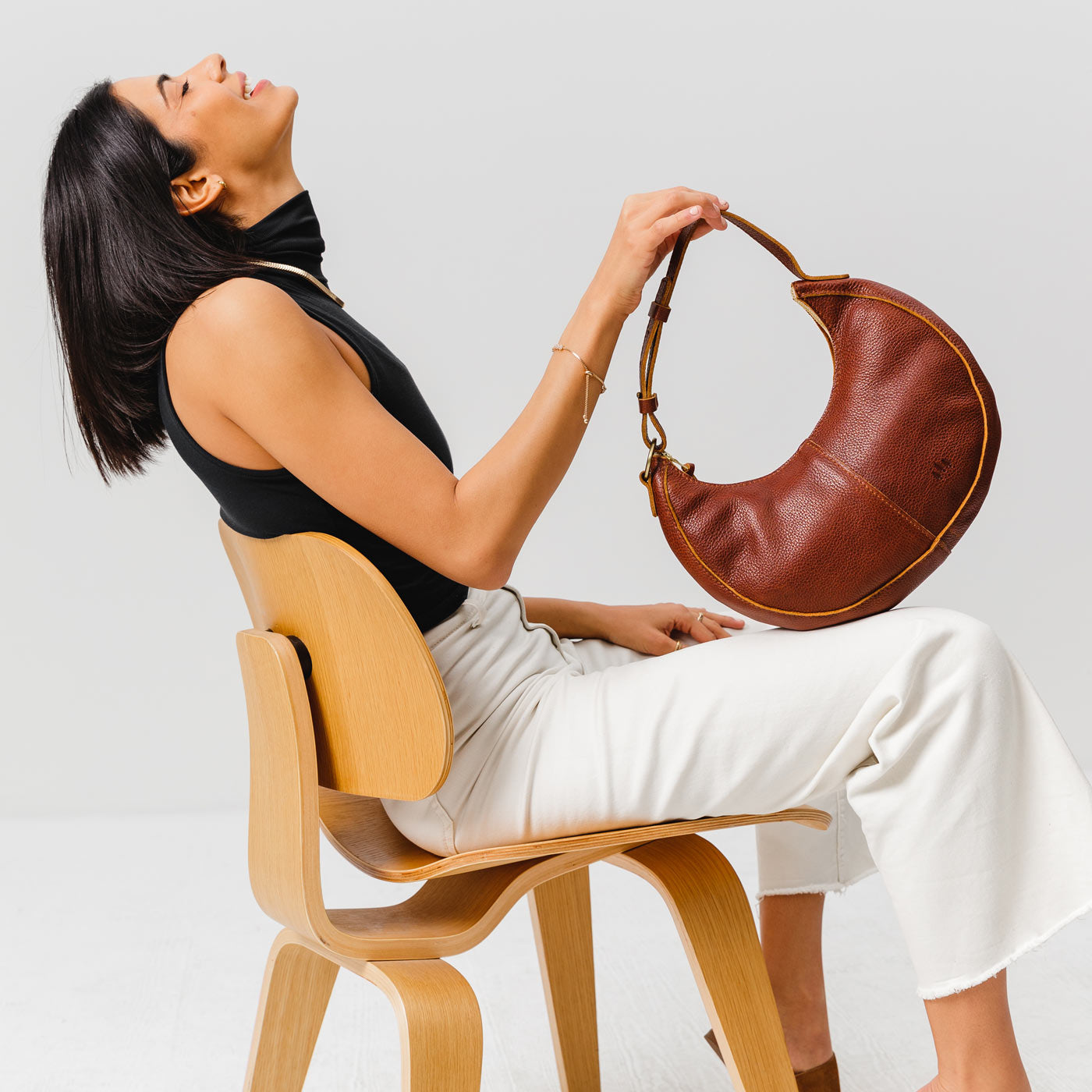 Nutmeg*Classic | Crescent shaped shoulder bag with zipper closure and adjustable strap