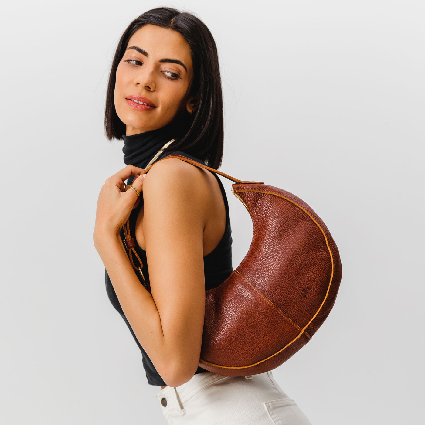 Nutmeg*Classic | Crescent shaped shoulder bag with zipper closure and adjustable strap