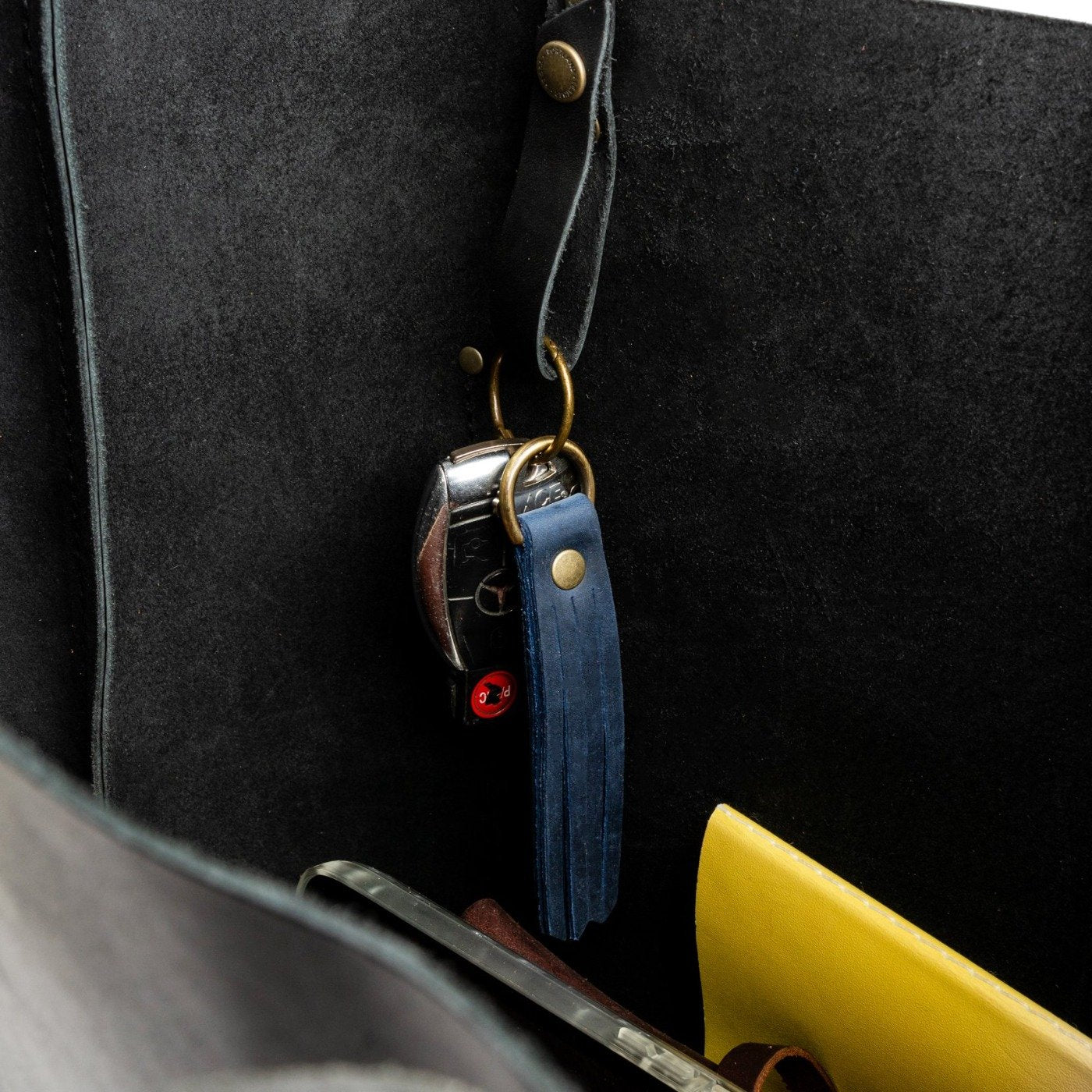 Deep Water Large | slim leather tassel with brass ring